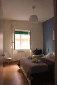 A bed or beds in a room at •TO ROME WITH LOVE•