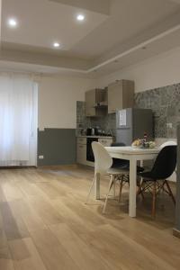 A kitchen or kitchenette at •TO ROME WITH LOVE•