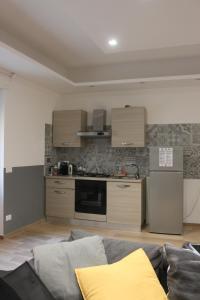 A kitchen or kitchenette at •TO ROME WITH LOVE•