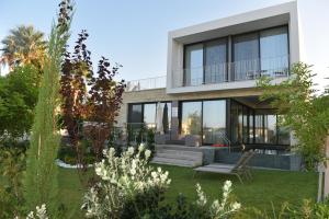 a house with a view of the yard at Akamas Turtle Beach №2 in Neo Chorio