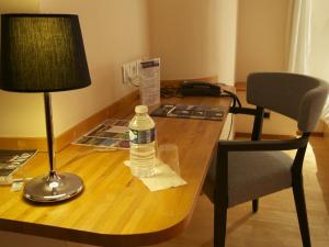 Posezení v ubytování Logis Hôtel Les Pages