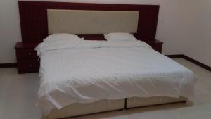 Katil atau katil-katil dalam bilik di اغصان الريف لشقق المفروشة