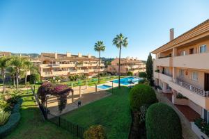 an aerial view of a apartment complex with a yard at Penthouse Apartment in Elviria in Marbella