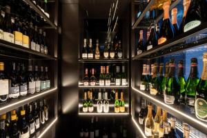 a bar with lots of bottles of wine at Stella Hotel - My Dolomites Experience in Selva di Val Gardena +79 photos