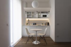 Kuchyňa alebo kuchynka v ubytovaní Fiorentini Residence MILANO + 37 fotografií