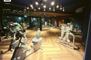a gym with several exercise bikes in a room at Homestay Sandakan CLL in Sandakan