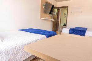 Postel nebo postele na pokoji v ubytování Hotel Salinero - Zipaquirá