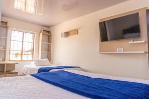 Postel nebo postele na pokoji v ubytování Hotel Salinero - Zipaquirá