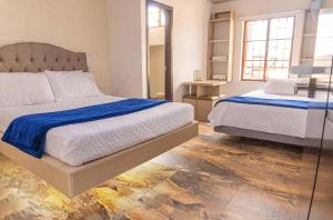 Postel nebo postele na pokoji v ubytování Hotel Salinero - Zipaquirá