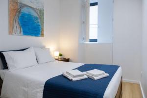 Postel nebo postele na pokoji v ubytování Porto Santa Maria Apartments