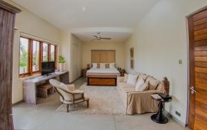 a living room with a couch and a bed at W15 in Weligama