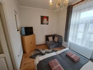 Postel nebo postele na pokoji v ubytování Aranyvár Apartment