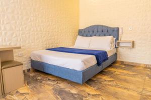 Postel nebo postele na pokoji v ubytování Hotel Salinero - Zipaquirá