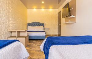 Postel nebo postele na pokoji v ubytování Hotel Salinero - Zipaquirá