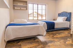 Postel nebo postele na pokoji v ubytování Hotel Salinero - Zipaquirá