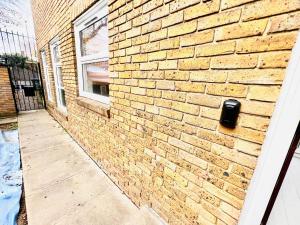a brick wall with a mailbox on the side of a building at Extra Large Double one Bedroom Rental Near Central London & Close to Transport in London