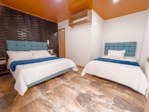 Postel nebo postele na pokoji v ubytování Hotel Salinero - Zipaquirá