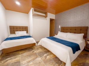 Postel nebo postele na pokoji v ubytování Hotel Salinero - Zipaquirá