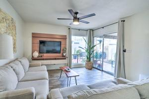 a living room with a couch and a flat screen tv at Pet-Friendly Litchfield Park Vacation Rental! in Litchfield Park