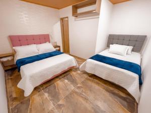 Postel nebo postele na pokoji v ubytování Hotel Salinero - Zipaquirá
