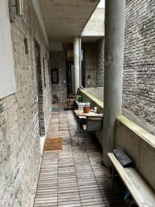 an empty hallway with tables and benches in a building at Deutzer Freiheit in Cologne