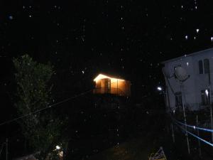 a small house with a light on it at night at Cottage house in K'eda