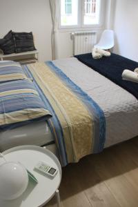 A bed or beds in a room at •TO ROME WITH LOVE•