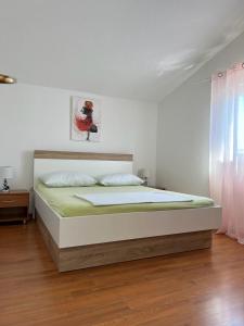 Postel nebo postele na pokoji v ubytování Vila Rosanda + 8 fotografií