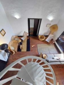 a view of a room with a spiral staircase at CASA YOOJ designers house in teguise in Teguise