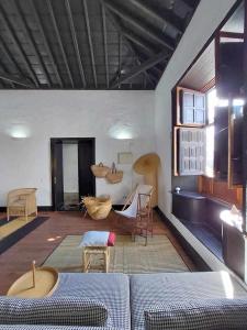 a living room with a couch and a table at CASA YOOJ designers house in teguise in Teguise