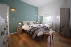 a bedroom with a large bed and a table at Yorkshire Dales Lodge 6 Family 3 bed in Richmond