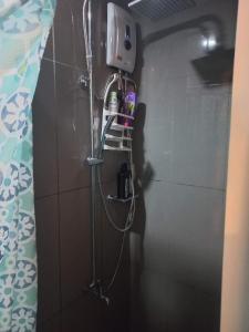 a shower in a bathroom with a shower at Air Residences Condominium Deluxe in Manila