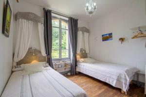 Postel nebo postele na pokoji v ubytování Villa Tranquillité