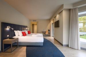 Кровать или кровати в номере Melia Setubal