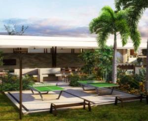 a group of ping pong tables and a palm tree at Casa con alberca en Residencial Portovela in Nuevo Vallarta 