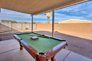 a pool table sitting on top of a patio at Bullhead City Home Less Than 2 Mi to Colorado River! in Bullhead City