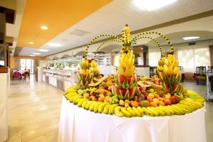 a display of bananas and other fruits on a table at Seramar Hotel Luna - Luna Park Adults Only in El Arenal