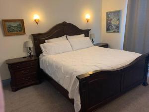 a bedroom with a large bed and a night stand at Trip6 Historic Brick Home in Helena