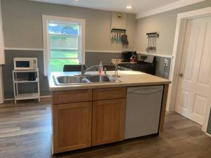 a kitchen with a sink and a counter top at Trip6 Historic Brick Home in Helena