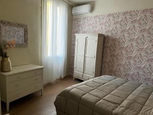 A bed or beds in a room at Maison La Balconata
