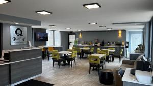 a restaurant with tables and chairs and a bar at Quality Inn Asheville Airport in Fletcher