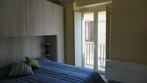 Postel nebo postele na pokoji v ubytování La Fara B&B