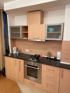 a kitchen with a stove and a counter top at SliverCity next to paradise mall in Sofia