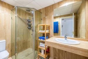 a bathroom with a sink and a shower at Penthouse Apartment in Elviria in Marbella +16 photos