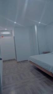 a bedroom with a bed in a room at Cabaña Milan in Aguachica