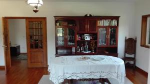 a room with a table with a white table cloth at Casa do Senhor da Ponte in Gondifelos