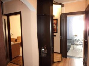 a hallway with two doors and a room with a table at 5й Зарічній 44 in Kryvyi Rih