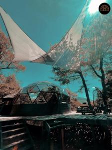 a view of a picnic table with trees and a sky at Black Domes in Nevados de Chillan