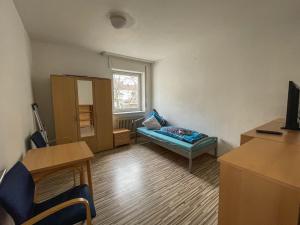 a living room with a couch and a window at Apartments Sülmerstrasse in Heilbronn