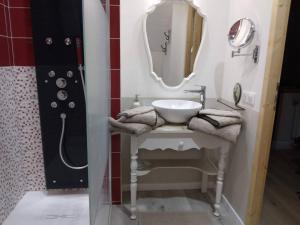 a bathroom with a sink and a mirror at Chalet Mina in Sazos